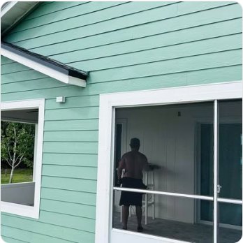 Rescreening a porch on a green clapboard house