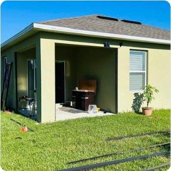 Newly screened lanai on a tan stucco home